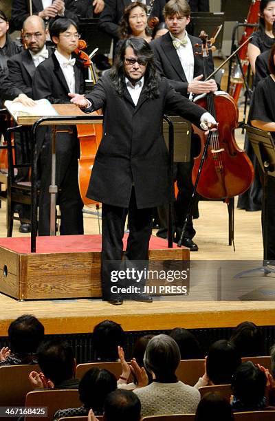 This picture taken on December 28, 2014 shows composer Mamoru Samuragochi dubbed "Japan's Beethoven" reacting to the audience after his symphony No.1...
