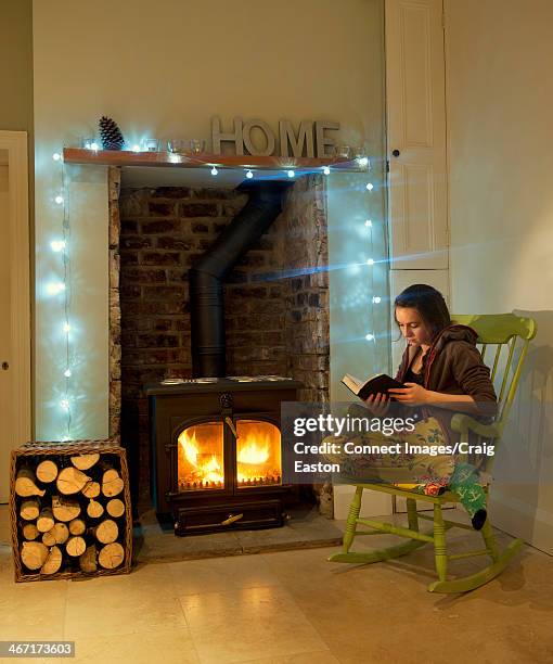 teenage girl relaxing at home - rocking chair stock pictures, royalty-free photos & images