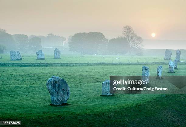 ancient stone circle at avebury, wiltshire, england - stone circle stock pictures, royalty-free photos & images