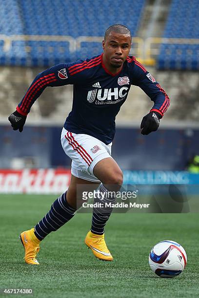 Charlie Davies of New England Revolution dribbles against the Montreal Impact during the second half at Gillette Stadium on March 21, 2015 in...