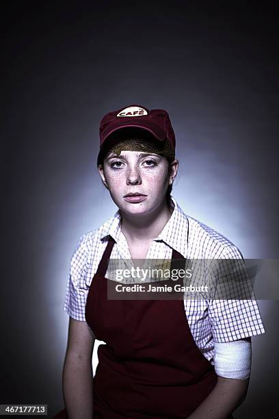 portrait of a exhausted female cafe worker - overworked waitress stock pictures, royalty-free photos & images