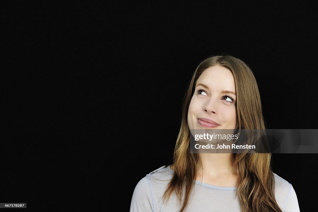 Studio portrait of happy positive woman