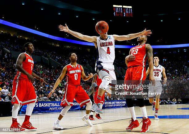 McConnell of the Arizona Wildcats goes up between Amir Williams and D'Angelo Russell of the Ohio State Buckeyes in the first half during the third...