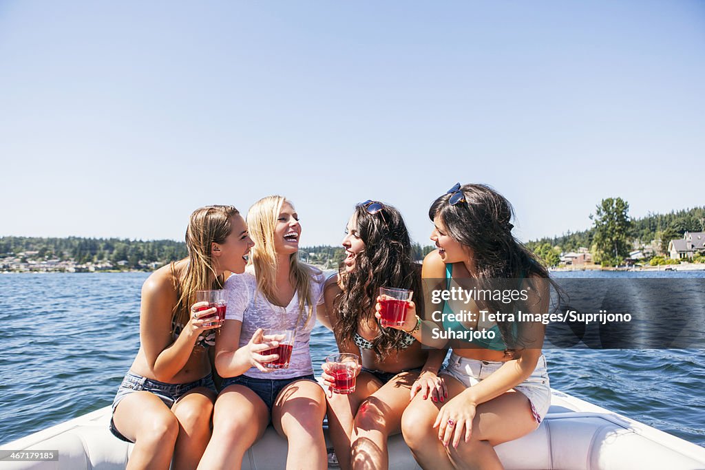 USA, Washington, Bellingham, Young women having fun on motorboat