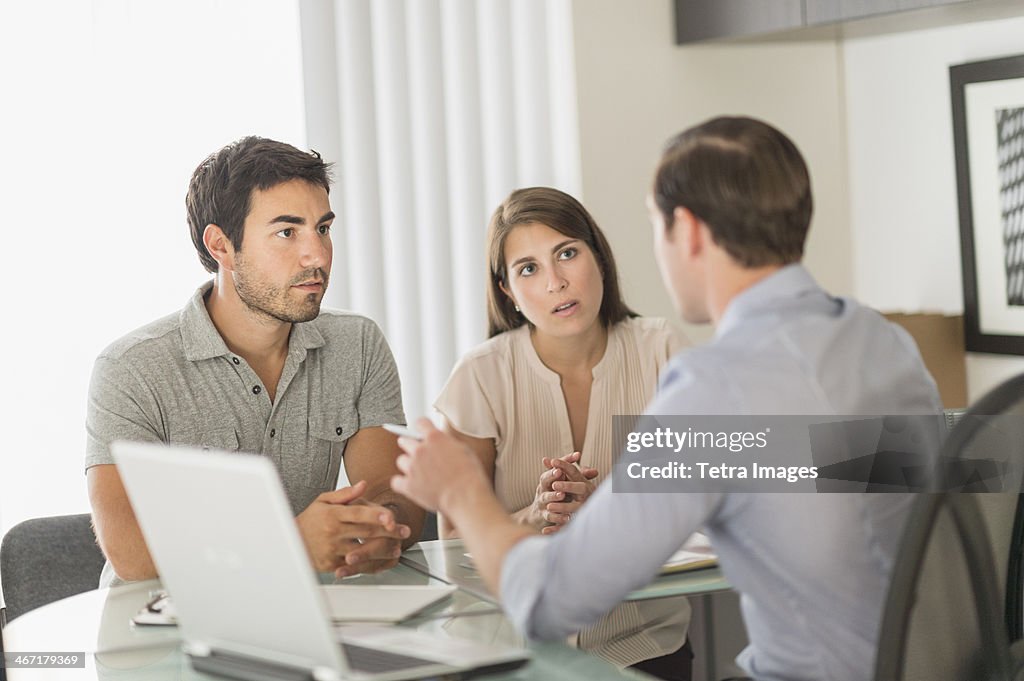 USA, New Jersey, Jersey City, Customers talking to advisor in office