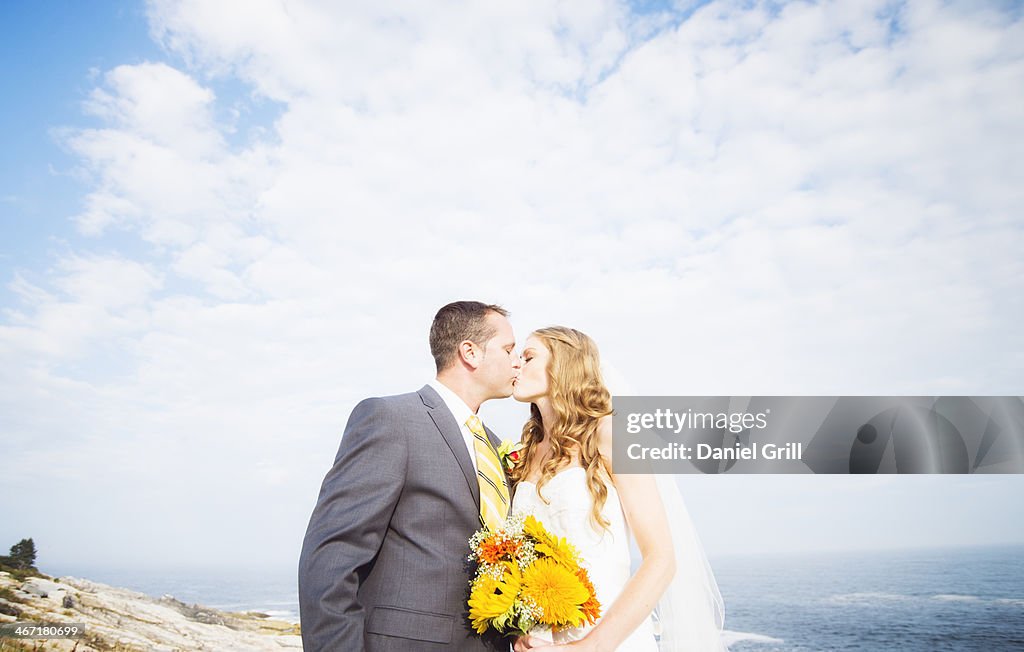 USA, Maine, Bristol, Portrait of married couple kissing