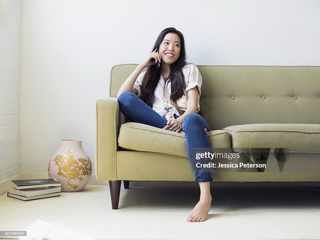 Woman sitting on sofa