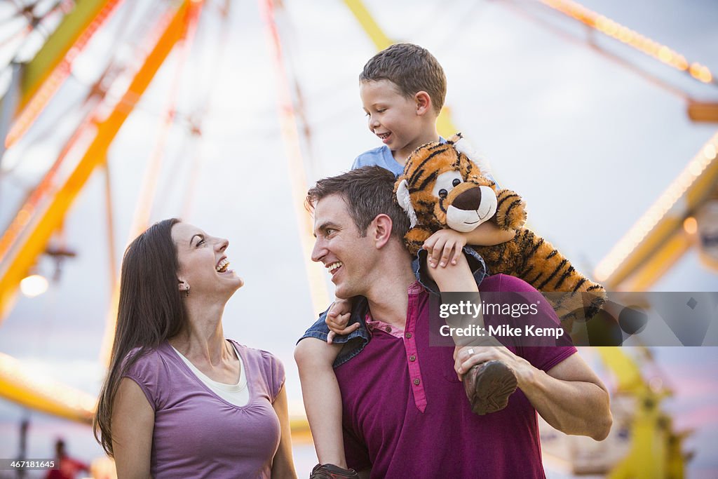 USA, Utah, Salt Lake City, Happy Family with son (4-5 ) in amusement park