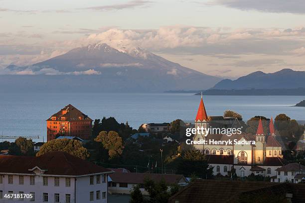 chile, lake district, puerto varas, town skyline with volcano in background - chile skyline stock pictures, royalty-free photos & images