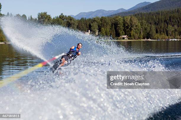 usa, montana, whitefish, whitefish lake, man waterskiing - waterskiing stock pictures, royalty-free photos & images