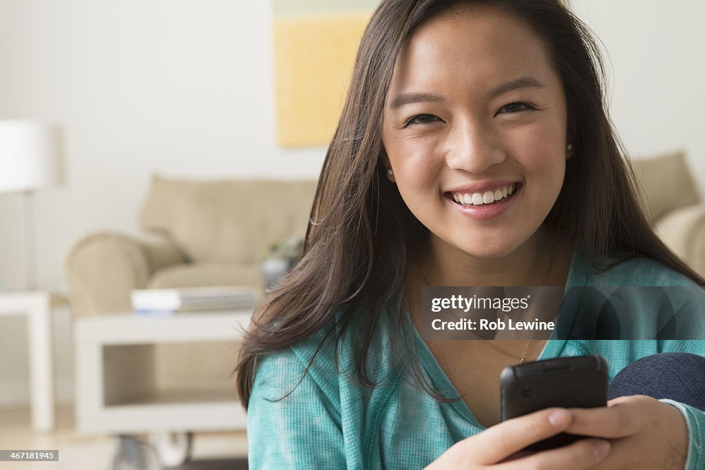 USA, California, Los Angeles, Portrait of teenage girl (16-17) with smartphone