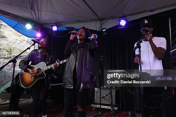 Musicians Erika Reynolds, Jessika Reynolds, and Auston Reynolds of James Davis perform at the AXE White Label Collective Party powered by SPIN at...