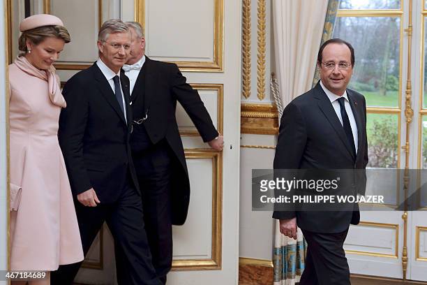 French President Francois Hollande arrives with Queen Mathilde and King Philippe of Belgium for a photo session at the Elysee Palace in Paris on...