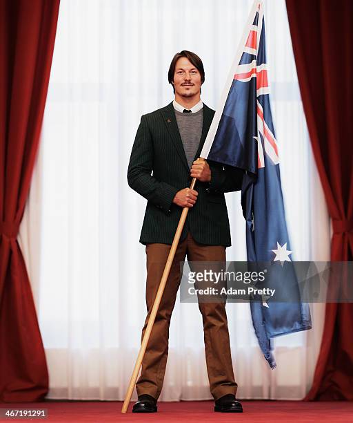 Alex Pullin of Australia poses with the Australian Flag after being announced as the Flag Bearer for Australia at the Sochi Olympics Opening Ceremony...