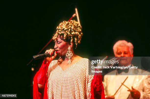Cuban-born American salsa singer Celia Cruz performs, with bandleader Tito Puente , during a Jazz at Lincoln Center concert at Alice Tully Hall, New...