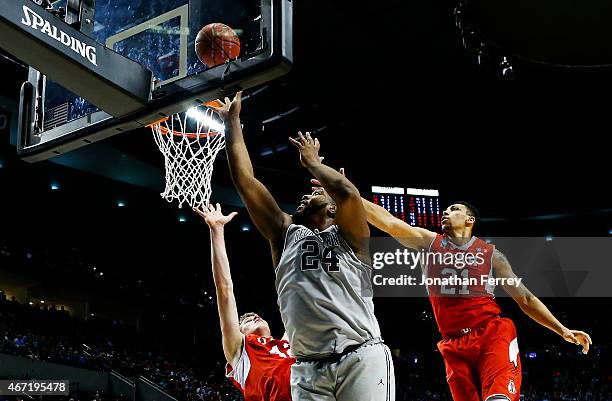 Joshua Smith of the Georgetown Hoyas goes up against Jakob Poeltl of the Utah Utes in the second half during the third round of the 2015 NCAA Men's...