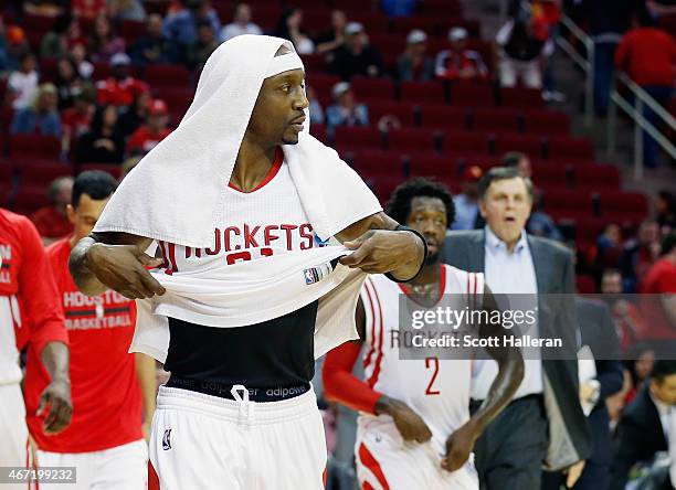 Jason Terry, Patrick Beverley and head coach Kevin McHale of the Houston Rockets walk off the court after the Rockets were defeated by the Phoenix...