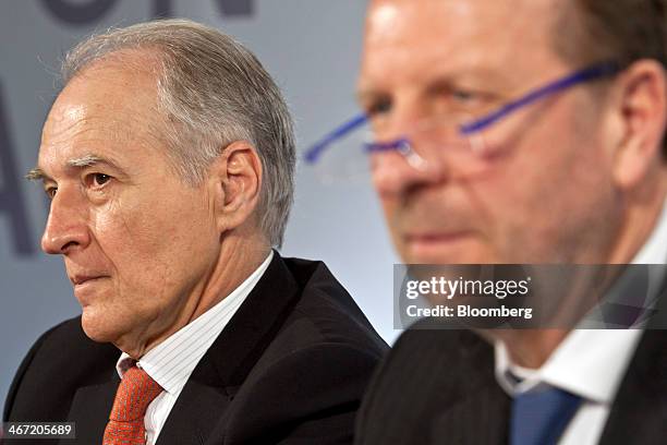 Xavier Huillard, chief executive officer of Vinci SA, left, sits with Christian Labeyrie, chief financial officer of Vinci SA, during the company's...