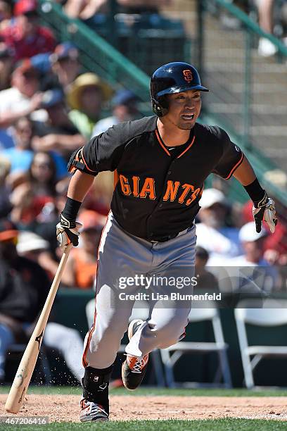 Nori Aoki of the San Francisco Giants bats in the third inning against the Los Angeles Angels of Anaheim during a spring training game at Tempe...