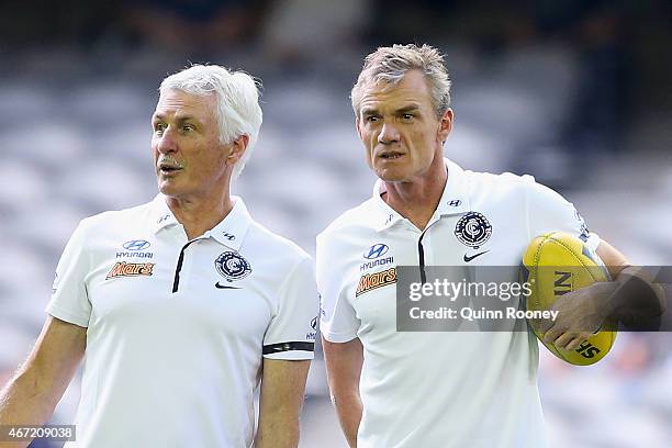 Head coach Michael Malthouse of the Blues talks to assistant coach Dean Laidley during the NAB Challenge AFL match between the Carlton Blues and the...