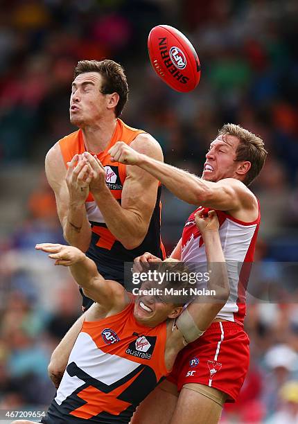 Jeremy Cameron and Adam Treloar of the Giants contest a mark during the NAB Challenge AFL match between the Greater Western Sydney Giants and the...