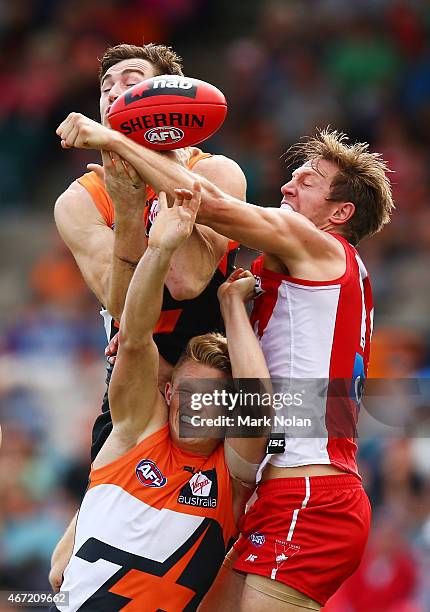Jeremy Cameron and Adam Treloar of the Giants contest a mark during the NAB Challenge AFL match between the Greater Western Sydney Giants and the...