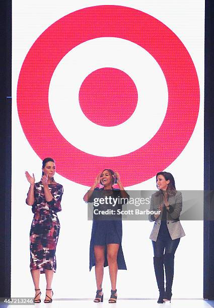 Target designers Dannii Minogue and Giaan Rooney dance with Australian singer Jessica Mauboy on the runway at the Target show during Melbourne...