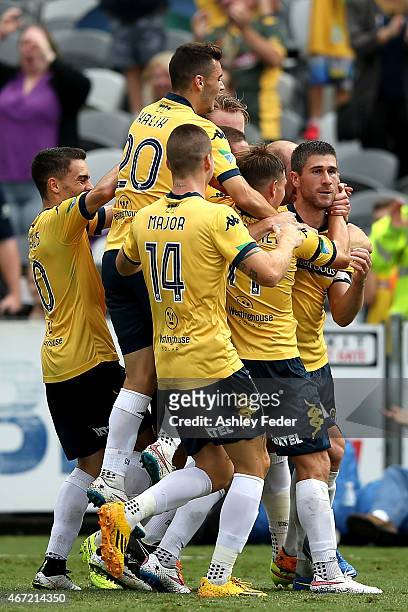 Mariners team mates celebrate a goal by Nick Montgomery during the round 22 A-League match between the Central Coast Mariners and the Perth Glory at...