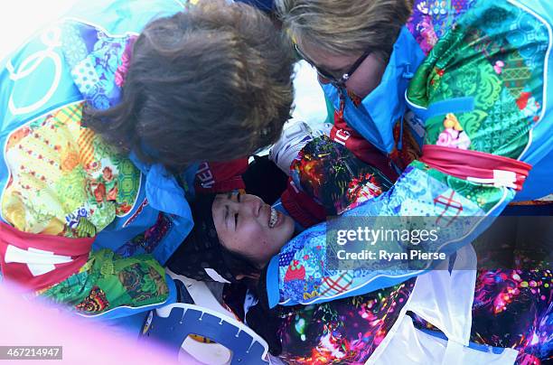 Miki Ito of Japan suffers an injury in the warm up before the Ladies' Moguls Qualification at Rosa Khutor Extreme Park on February 6, 2014 in Sochi,...