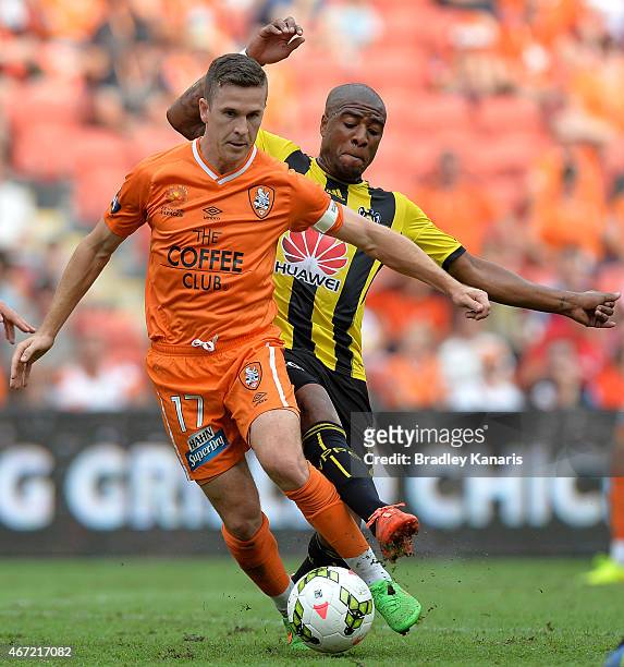 Matt McKay of the Roar is challenged by Roy Krishna of Wellington Phoenix during the round 22 A-League match between the Brisbane Roar and the...