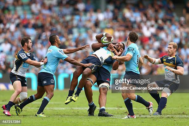 Henry Speight of the Brumbies is tackled by Will Skelton of the Waratahs during the round six Super Rugby match between the Waratahs and the Brumbies...