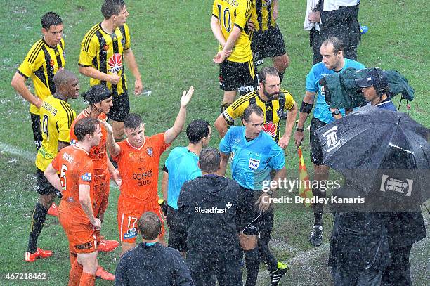 Matt McKay of the Roar shows his frustrations after referee Alan Milliner calls off the game due to wet weather during the round 22 A-League match...