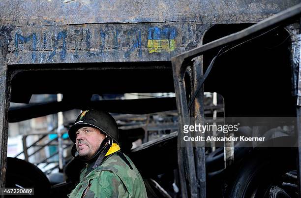 An anti-government protester mans a barricade at Hrushevskoho Street on February 6, 2014 in Kiev, Ukraine. German Foreign Minister Frank-Walter...