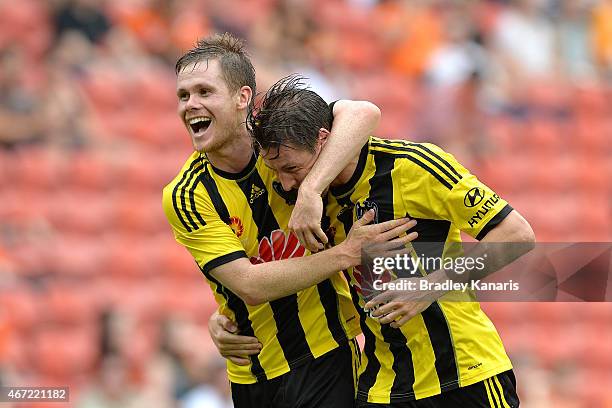 Nathan Burns of Wellington Phoenix is congratulated by team mate Michael McGlinchey after scoring a goal during the round 22 A-League match between...