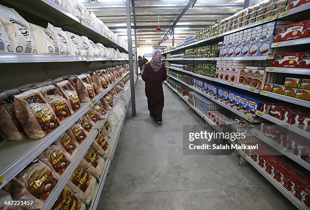 Syrian refugees shop at the first hypermarket that is opened in Zaatari camp for Syrian refugees on February 6, 2014 in Jordan. The United Nations...