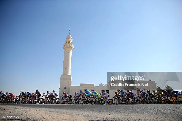 The peloton rides past a mosque during stage three of the 2014 Ladies Tour of Qatar from Katara Cultural Village to Al Khor Corniche on February 6,...