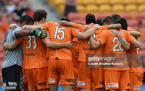Roar players embrace before the round 22 A-League match between the Brisbane Roar and the Wellington Phoenix at Suncorp Stadium on March 22, 2015 in...
