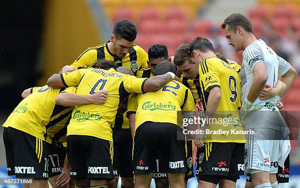 Wellington players embrace before the round 22 A-League match between the Brisbane Roar and the Wellington Phoenix at Suncorp Stadium on March 22,...