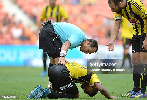 Roy Krishna of Wellington Phoenix is checked on by referee Alan Milliner during the round 22 A-League match between the Brisbane Roar and the...