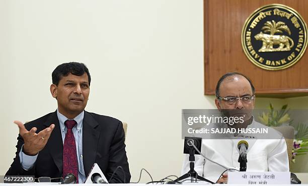 Reserve Bank of India governor, Raghuram Rajan and Indian finance minister Arun Jaitley address a joint press conference after a meeting with the...