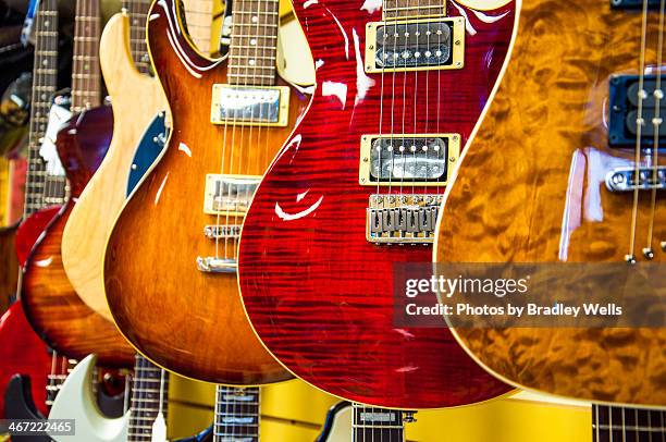 choices, choices... - guitar shop stock pictures, royalty-free photos & images