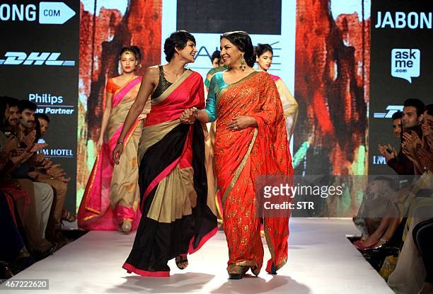 Indian Bollywood actress Shabana Azmi showcases a creation by designer Mandira Bedi on the fifth day of the Lakme Fashion Week summer/resort 2015 in...