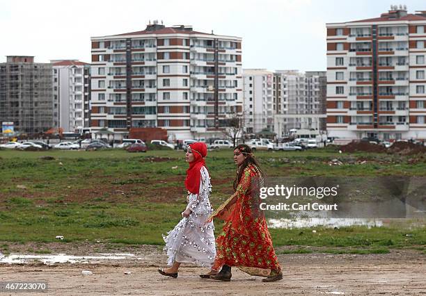 Kurdish girls in traditional dresses walk to Kurdish New Year celebrations on March 21, 2015 in Diyarbakir, Turkey. Diyarbakir has one of the largest...