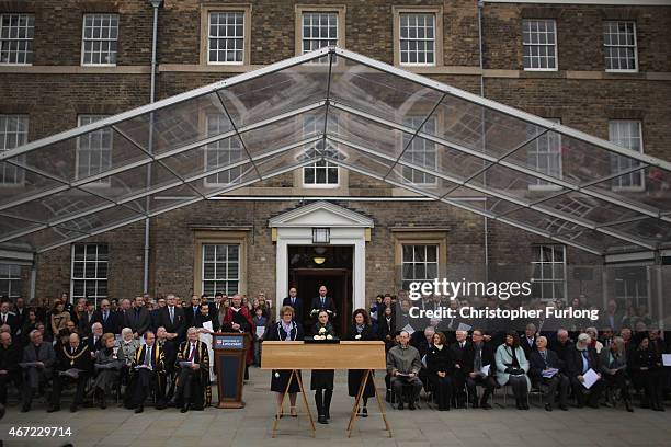 University staff, Professor Sarah Hainsworth , Dr Jo Appleby and Dr Turi King place white roses on the coffin containing the remains of King Richard...