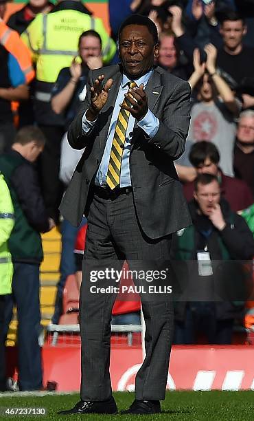 Brazilian football legend Edson Arantes do Nascimento, known as "Pele" is introduced to the crowd at half time in the English Premier League football...