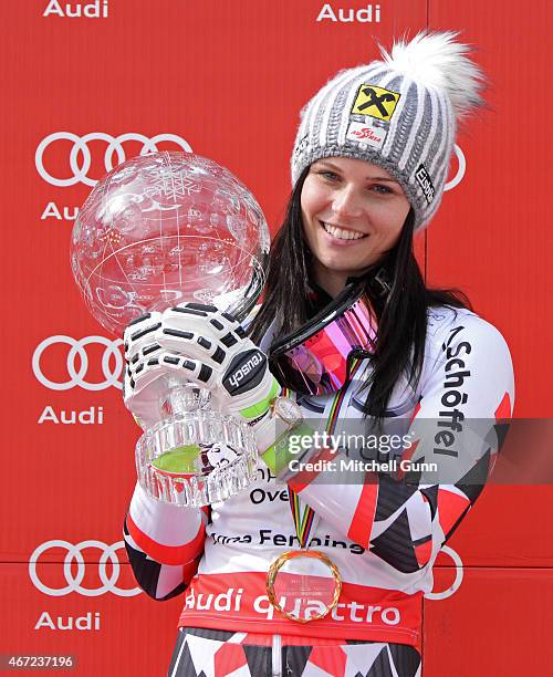 Anna Fenninger of Austria poses with the crystal globe for the overall title after the FIS Alpine Ski World Cup women's giant slalom race on March...