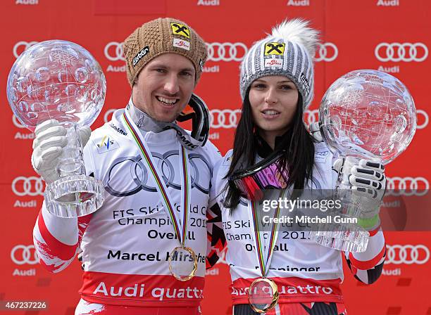 Marcel Hirscher of Austria and Anna Fenninger of Austria pose with the crystal globes for the overall titles after the FIS Alpine Ski World Cup men's...