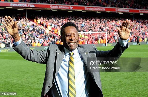 Pele comes onto the pitch at half time of the Barclays Premier League match between Liverpool and Manchester Untied at Anfield on March 22, 2015 in...