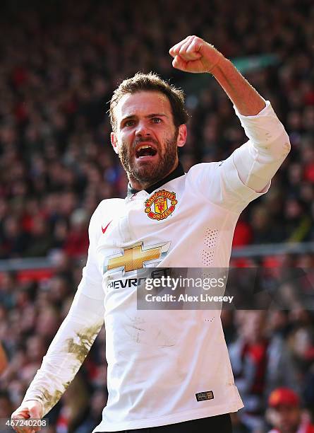 Juan Mata of Manchester United celebrates scoring his second goal during the Barclays Premier League match between Liverpool and Manchester United at...