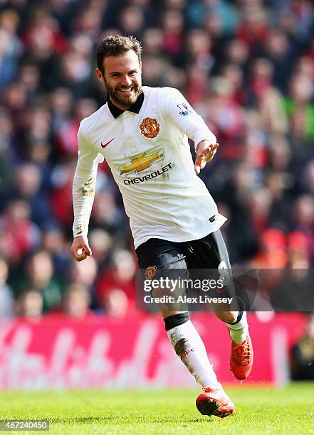 Juan Mata of Manchester United celebrates scoring his second goal during the Barclays Premier League match between Liverpool and Manchester United at...